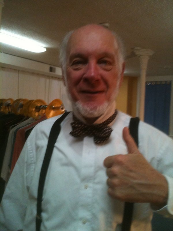 Charlie (Ray Mahoney) ties his bow tie